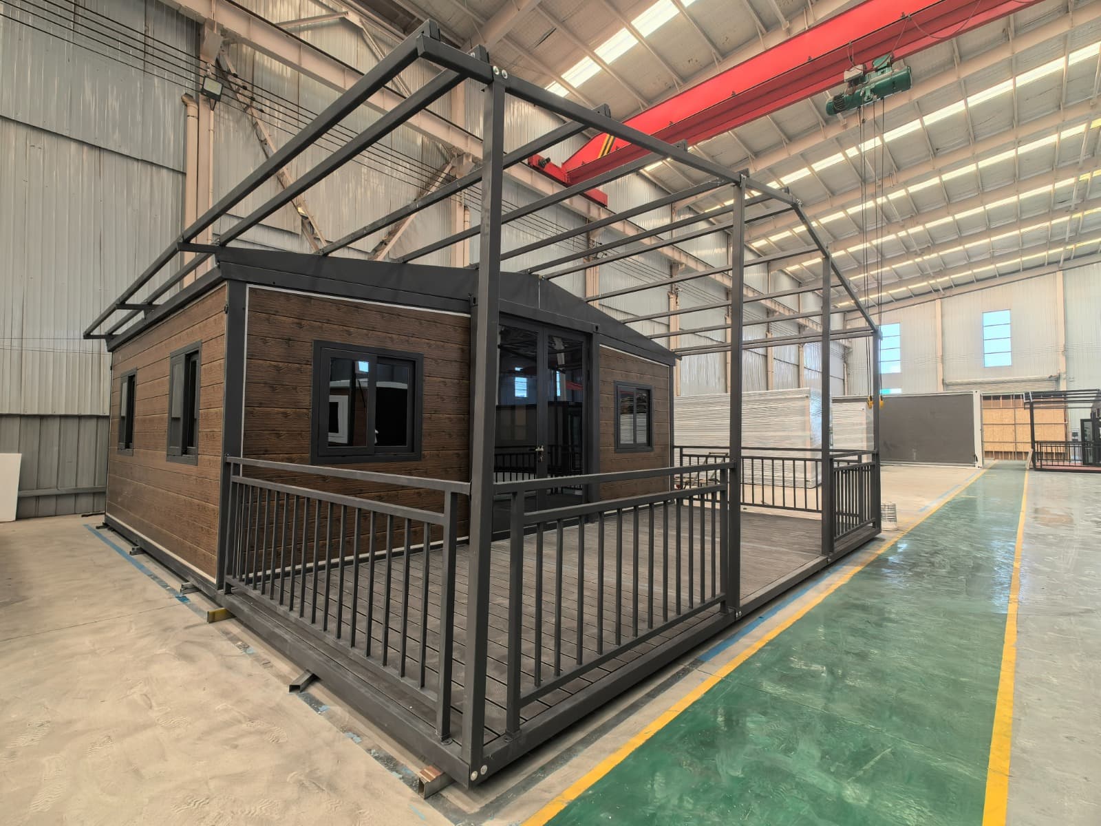 Timber-look Class 1a expandable home with deck expanded inside the factory before shipment